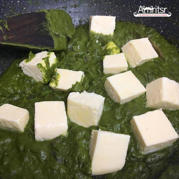 Add paneer cubes to cooked palak masala