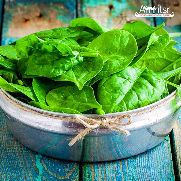 Spinach leafs in a vessel